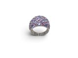 a close up of a ring on a white surface