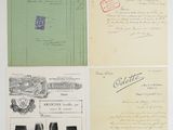 several old papers with stamps and stamps on them sitting on a table