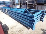 a close up of a pile of metal pallets in a warehouse