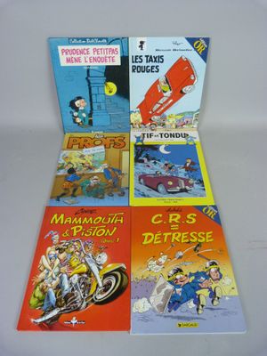 quatre livres pour enfants alignés sur une surface blanche