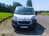 a white van that is parked on the side of the road