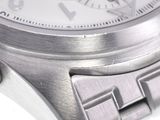 a close up of a watch on a white surface