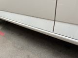 a white car parked on the side of the road