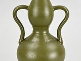 a green vase with two handles on a white background