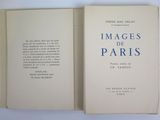 a book opened to show a picture of the paris city