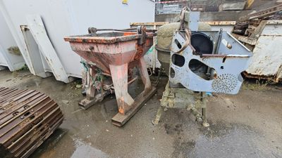 two machines that are next to each other in the yard
