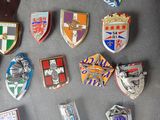 a lot of badges that are on a table