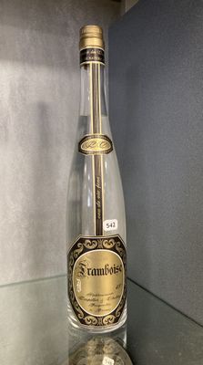 a bottle that is sitting on a glass shelf