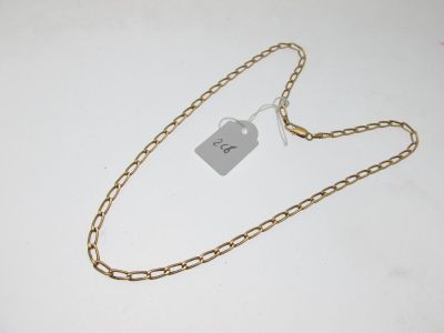 a close up of a gold chain with a tag on it