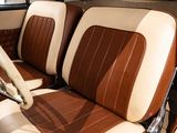 a brown and white seat in a car with a steering wheel