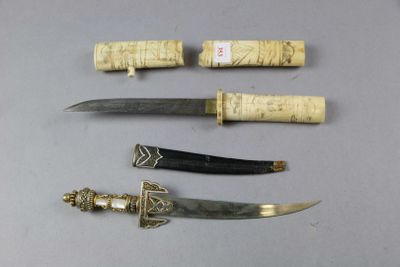 several different types of knives are displayed on a table