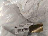 a close up of a white shirt with a tag on it