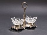 pair of crystal glass candle holders on cast iron stand