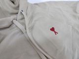 a white jacket with a red heart on it