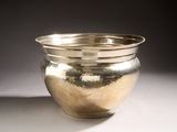 a silver bowl that is sitting on a table