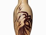 a vase that has a picture of a bird on it