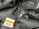 a close up of a jacket with a tag on it