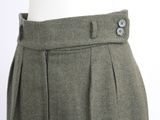 a close up of a person ' s pants with buttons on them