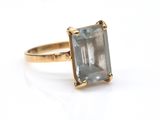an image of a ring with a blue topaz stone