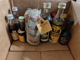 many bottles of alcohol in a box with a price tag on it