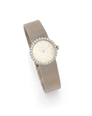 a lady ' s wrist watch with a diamond set bezel