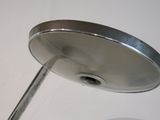 a close up of a metal object on a white surface