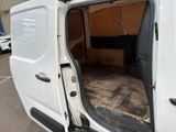 a white van with the door open in a parking lot