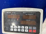 a close up of a digital scale on a table
