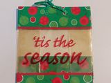 a close up of a gift bag with a tag attached to it