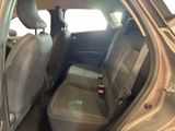 the back seats of a car with a bottle of beer in the passenger seat