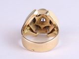 an image of a gold ring with a brown diamond