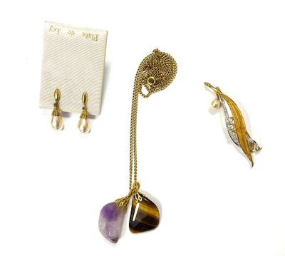 three pieces of jewelry including a necklace, earrings, and a broochet