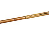 an old pick axe with a wooden handle on a white background