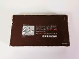 a small box of chocolate sitting on a white surface