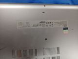 a close up of a laptop with a barcode on the back