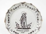 une assiette sur laquelle est représenté un saint