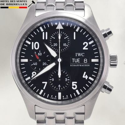 a close up of a watch with a black face