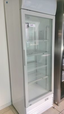 a refrigerator that is sitting in the middle of a kitchen