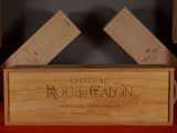 a wooden box with a wine bottle in it