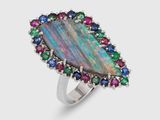 a close up of a ring with multi colored stones on it