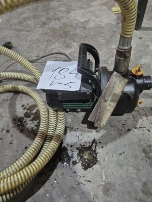a hose that is connected to a machine on the ground