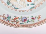 a plate with a picture of a man and a woman on it