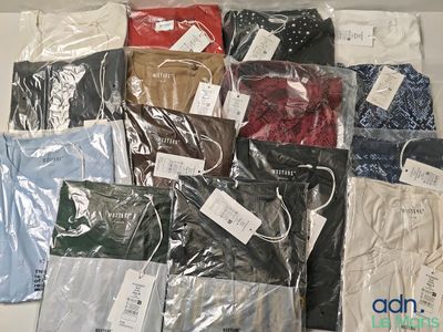 a lot of men ' s shirts that are wrapped in plastic