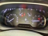 a close up of a car dashboard with a speedometer