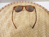 a close up of a pair of sunglasses on a basket