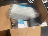 a cardboard box with a laptop in it sitting on a table