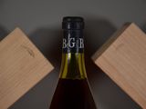 a bottle of wine that is sitting on a table