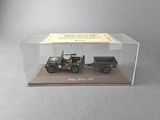 a display case with a jeep and a truck in it