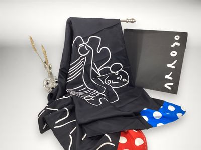 black and white scarf with a red polka dot design and a blue and white polka dot design
