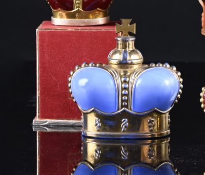 a figurine of a man and a crown on a table